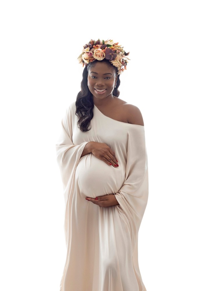 Elegant maternity portrait in flowing white dress with floral crown, Essex pregnancy photographer
