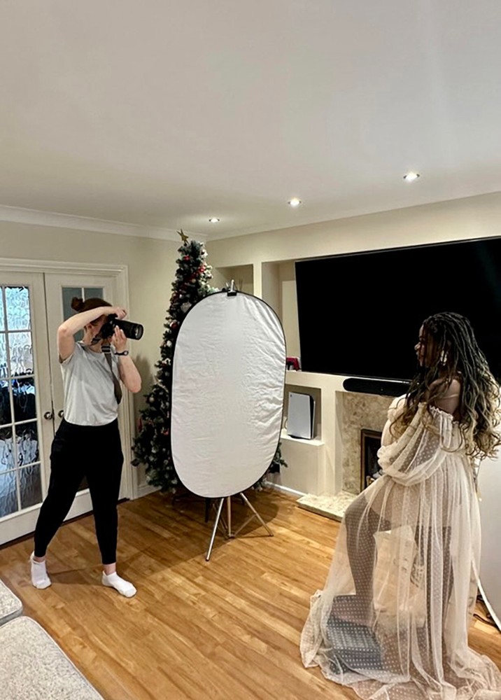 Mobile Essex maternity photographer capturing a candid indoor pregnancy photoshoot