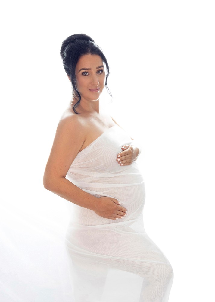 Ethereal white maternity photoshoot with flowing fabric in Maldon, Essex