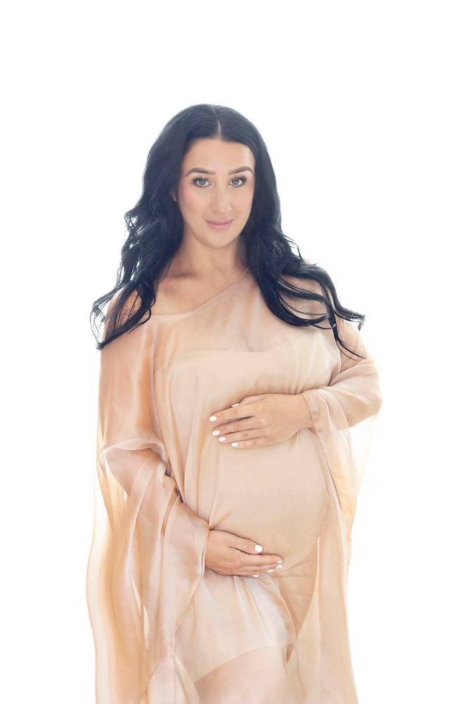 Stylish maternity portrait session in Wickford with a stunning gold-accented gown