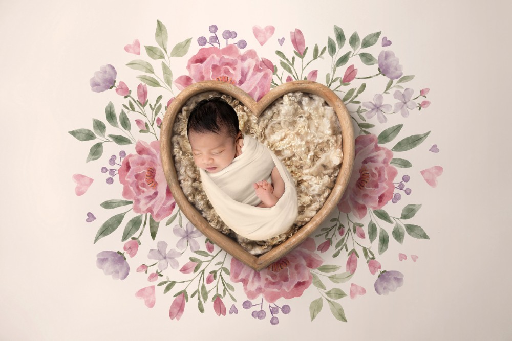 Newborn in wooden heart bowl with cream wool and pink watercolour flowers, Essex portrait